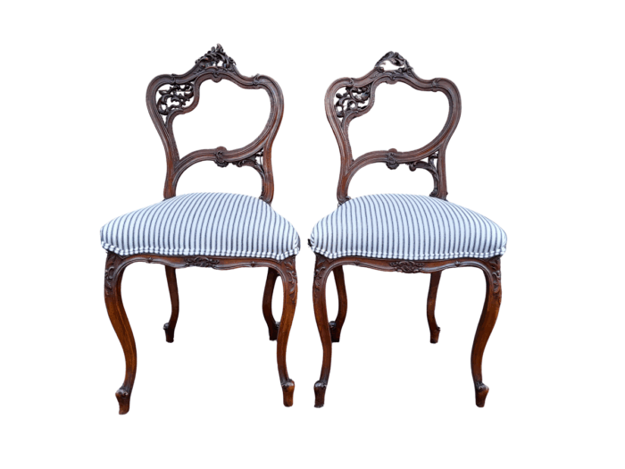 An Early 20th Century Pair Of French Carved Mahogany Chairs