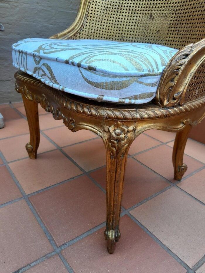 A 20th Century French Style Giltwood Rattan Chair Upholstered In Hand Printed Gold Design Fabric  - Image 3