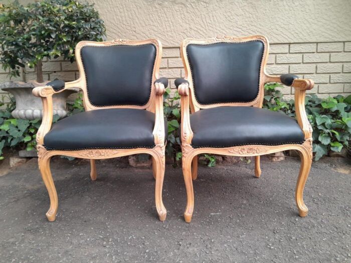 A 20th Century Pair of French Style Carved Fruitwood Armchairs in a Contemporary Bleached Finish and Upholstered in Leather - Image 2