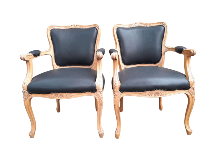 A 20th Century Pair of French Style Carved Fruitwood Armchairs in a Contemporary Bleached Finish and Upholstered in Leather