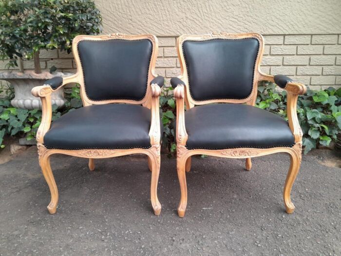 A 20th Century Pair of French Style Carved Fruitwood Armchairs in a Contemporary Bleached Finish and Upholstered in Leather - Image 3