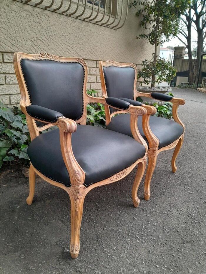 A 20th Century Pair of French Style Carved Fruitwood Armchairs in a Contemporary Bleached Finish and Upholstered in Leather - Image 5