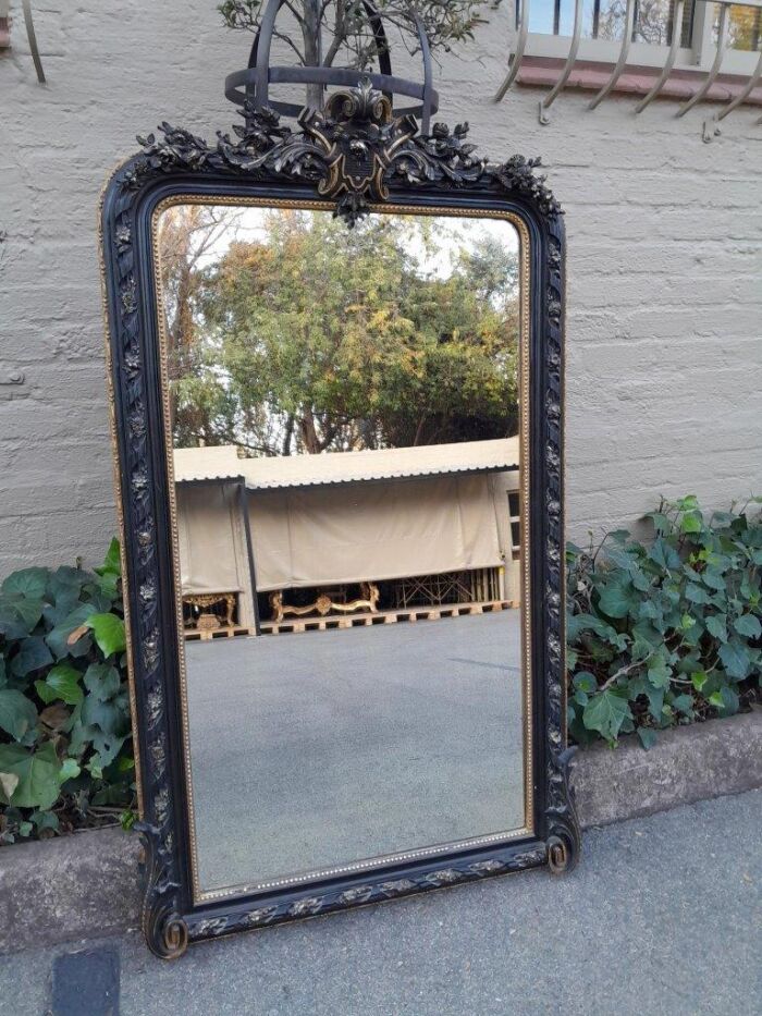 A 20th Century French Style Ebonized Hand-Gilt Ornate Mirror - Image 2