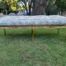 A 20th Century French Style Carved And Gilded Rattan Ottoman /  Bench With Seat Cushion In Hand Made Fabric