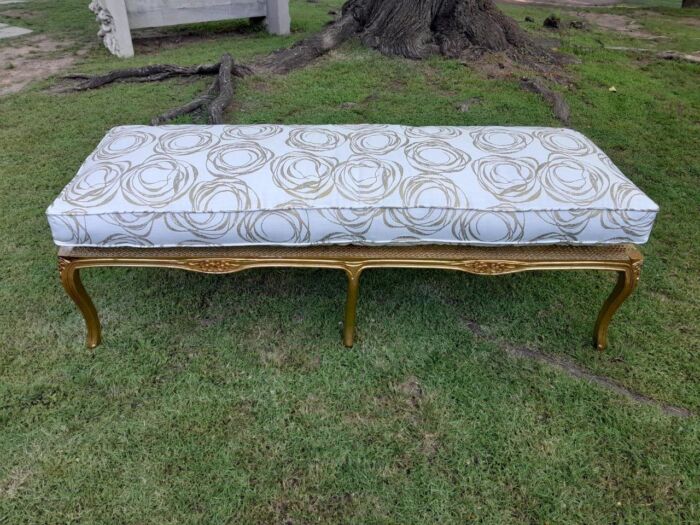 A 20th Century French Style Carved And Gilded Rattan Ottoman /  Bench With Seat Cushion In Hand Made Fabric - Image 2