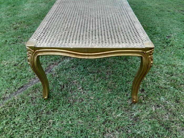 A 20th Century French Style Carved And Gilded Rattan Ottoman /  Bench With Seat Cushion In Hand Made Fabric - Image 5
