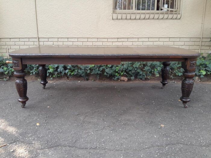 An Antique Victorian English Carved Oak Extending Dining Table on Castors and with Crank Handle - Image 2