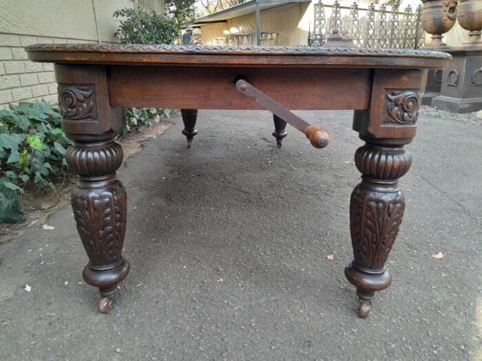 An Antique Victorian English Carved Oak Extending Dining Table on Castors and with Crank Handle - Image 8
