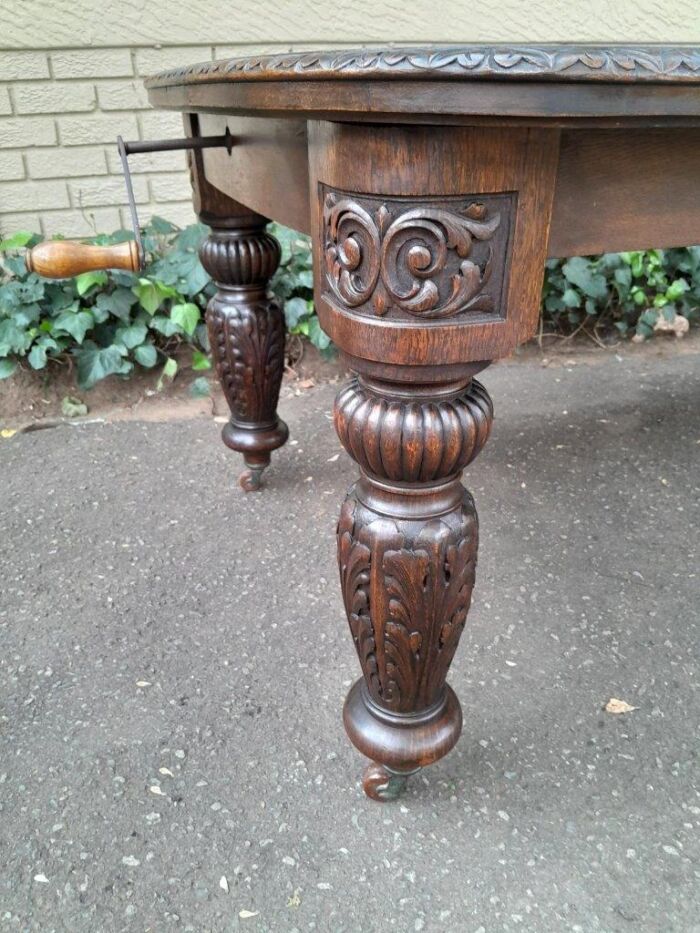 An Antique Victorian English Carved Oak Extending Dining Table on Castors and with Crank Handle - Image 9