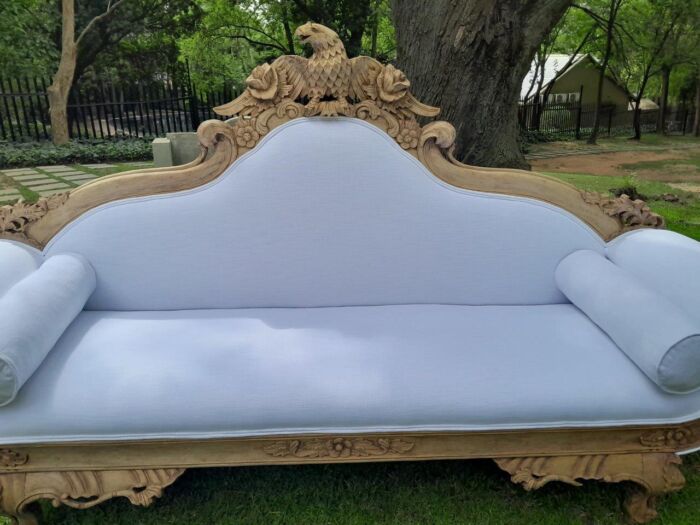 A 20th Century Ornately  Carved Eagle Settee In A Bleached Contemporary Finish Upholstered In A Slubby Linen - Image 6