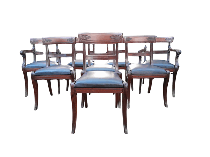 An Antique Late 18th / Early 19th Regency Set of Eight  Mahogany Dining Chairs Upholstered inleather. Comprising: A pair of Carvers and Six Side Chairs