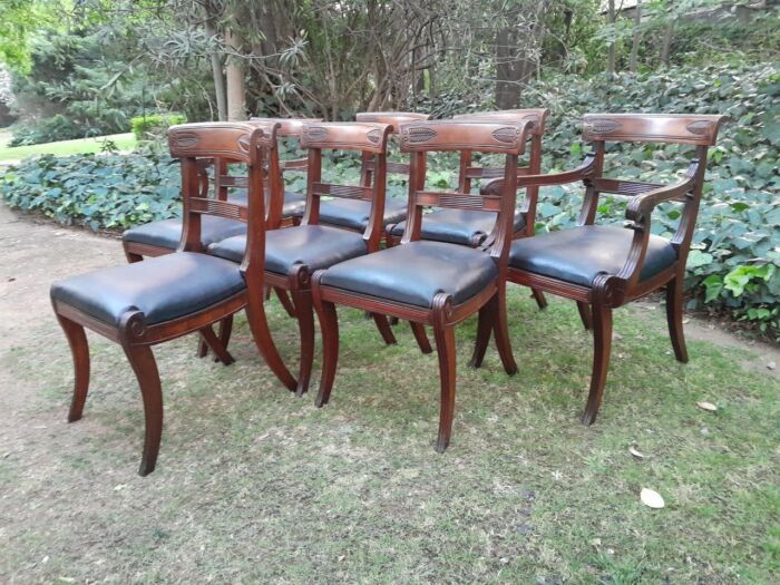 An Antique Late 18th / Early 19th Regency Set of Eight  Mahogany Dining Chairs Upholstered inleather. Comprising: A pair of Carvers and Six Side Chairs - Image 5