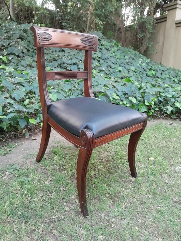 An Antique Late 18th / Early 19th Regency Set of Eight  Mahogany Dining Chairs Upholstered inleather. Comprising: A pair of Carvers and Six Side Chairs - Image 10