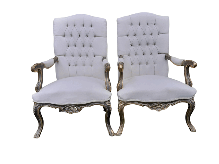 A 20th Century Pair Of French Style Carved And Giltwood High-Back Chairs In Leather