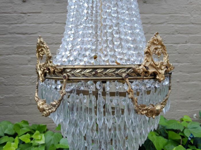 A 20th Century Empire French Style Brass And Crystal Chandelier - Image 4