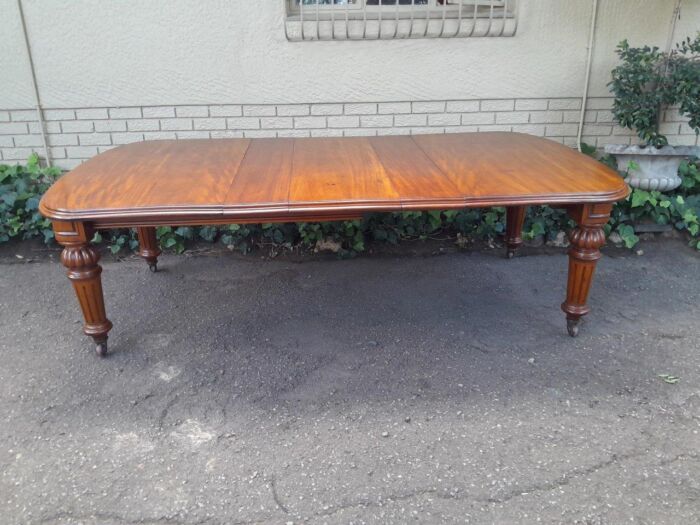 An Antique Victorian Mahogany Extension Dining Table With Original Porcelain Castors (Three Extensions) - Image 2