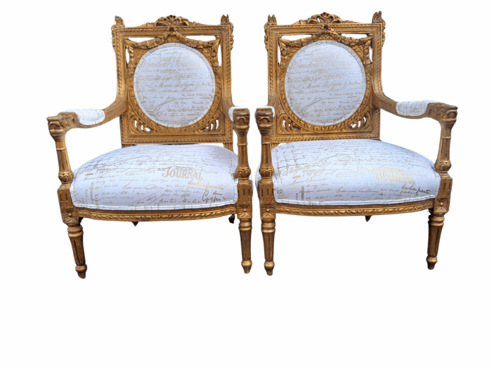 A 20th Century Pair Of French Ornately Carved And Gilded Armchairs