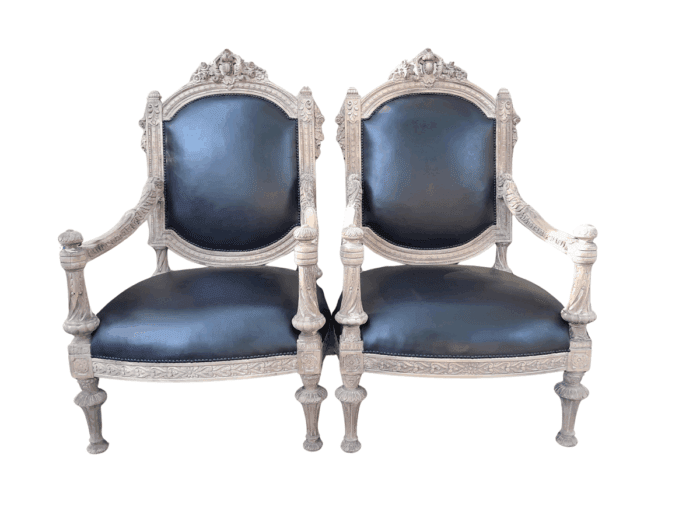 A 20TH Century French Style Ornately Carved Pair of  Oak Armchairs in a Contemporary Bleached Finish and Upholstered In Leather