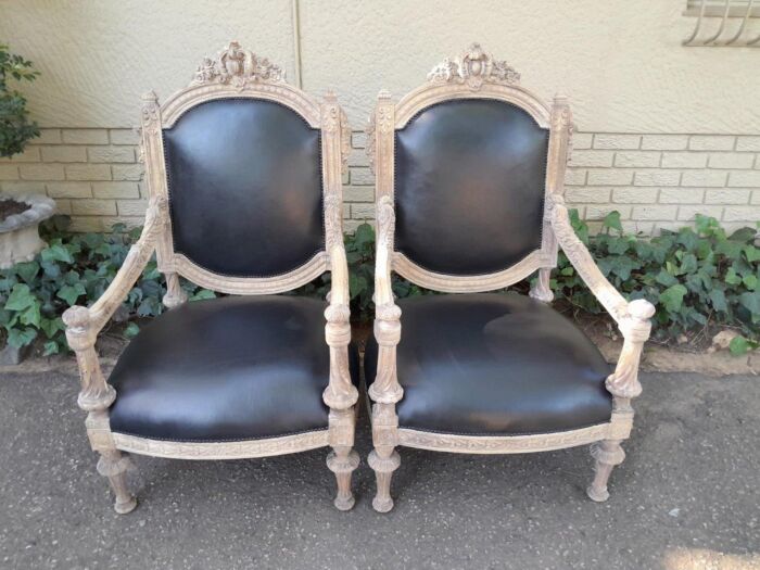 A 20TH Century French Style Ornately Carved Pair of  Oak Armchairs in a Contemporary Bleached Finish and Upholstered In Leather - Image 2