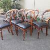 A 20th Century Set of Eight Victorian Style Mahogany Dining Chairs Upholstered in Leather - Image 3
