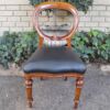 A 20th Century Set of Eight Victorian Style Mahogany Dining Chairs Upholstered in Leather - Image 4