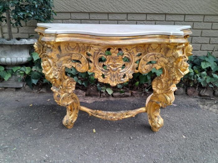 A 20th Century Heavily Carved and Hand Gilded with Gold Leaf Console Table with Cream Marble Top - Image 2