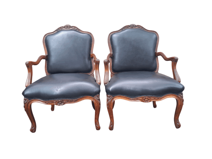A 20th Century Pair or Carved Mahogany Armchairs Upholstered In Leather