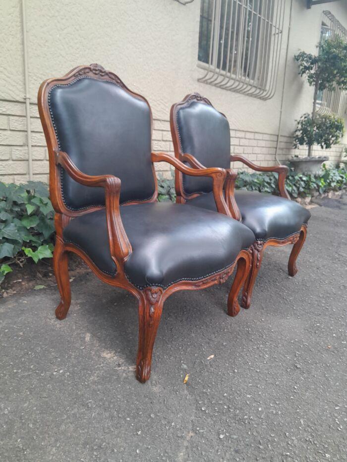 A 20th Century Pair or Carved Mahogany Armchairs Upholstered In Leather - Image 3