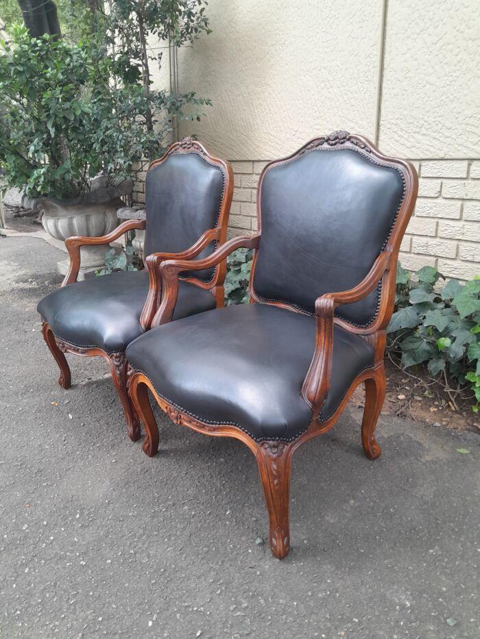 A 20th Century Pair or Carved Mahogany Armchairs Upholstered In Leather - Image 4