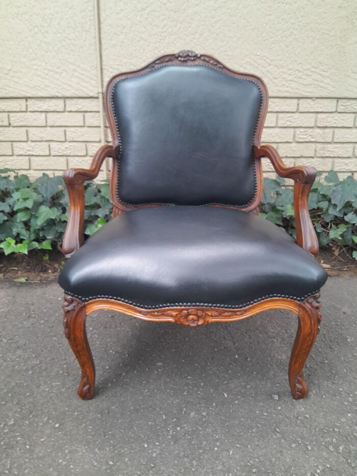 A 20th Century Pair or Carved Mahogany Armchairs Upholstered In Leather - Image 5