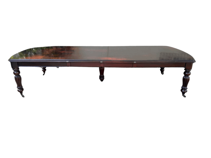 An Antique and Massive Victorian Mahogany Extending Table with Two Extensions and Original Castors and Crank Handle