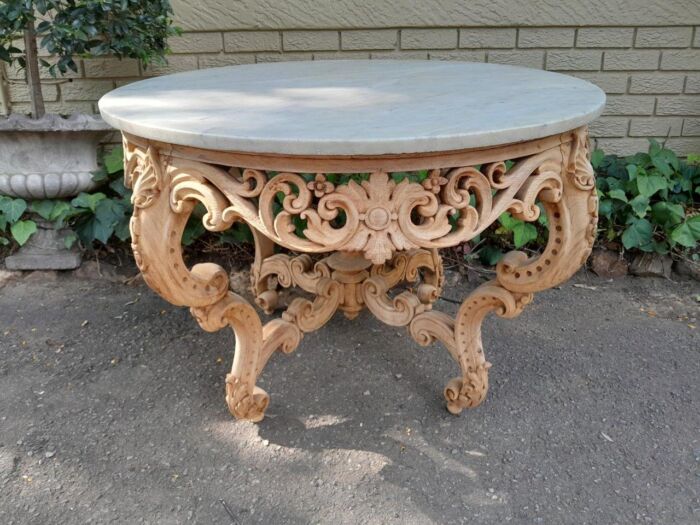 A20th Century Rococo Style Heavily Carved Teak Table with White Marble Top in a Contemporary Bleached Finish - Image 2