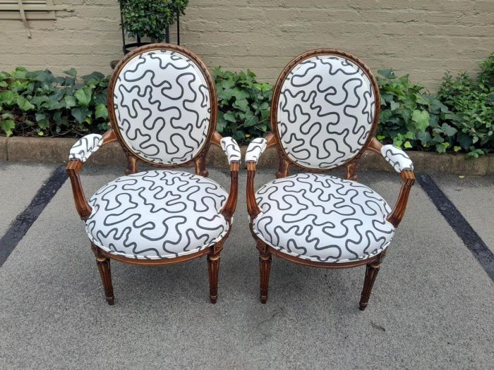 A 20th Century Pair Of French Louis XVI Style Walnut Chairs - Image 2