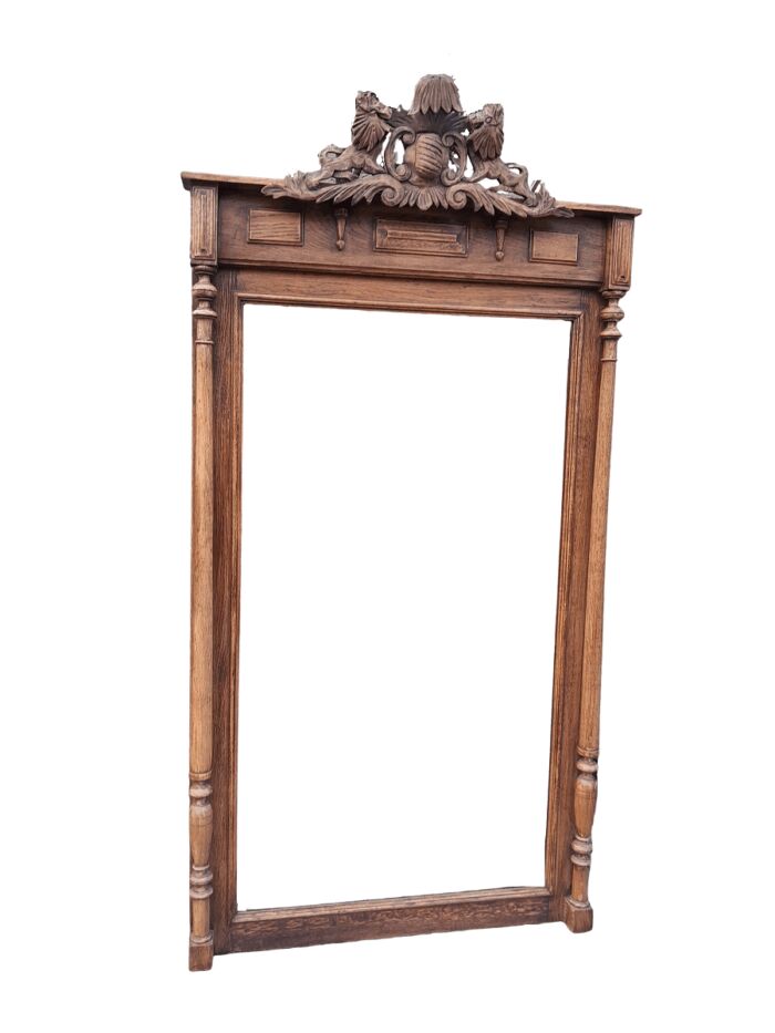 A 20th Century Oak Carved and Bevelled Mirror