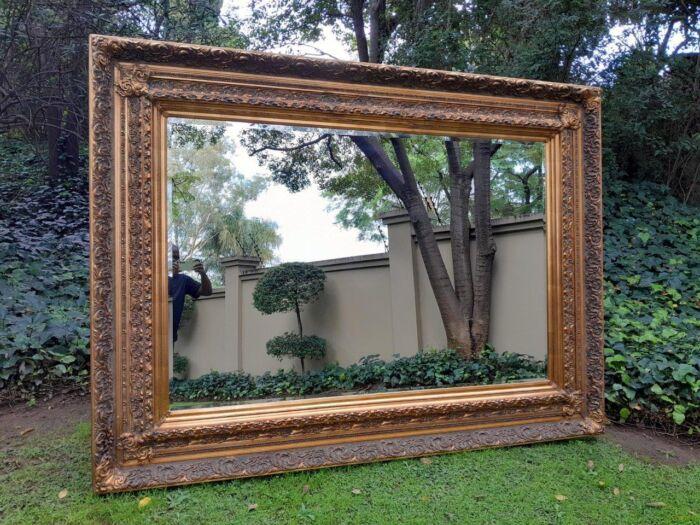 A 20th Century Heavily Carved And Bevelled Framed Mirror Of Large Proportions - Image 2