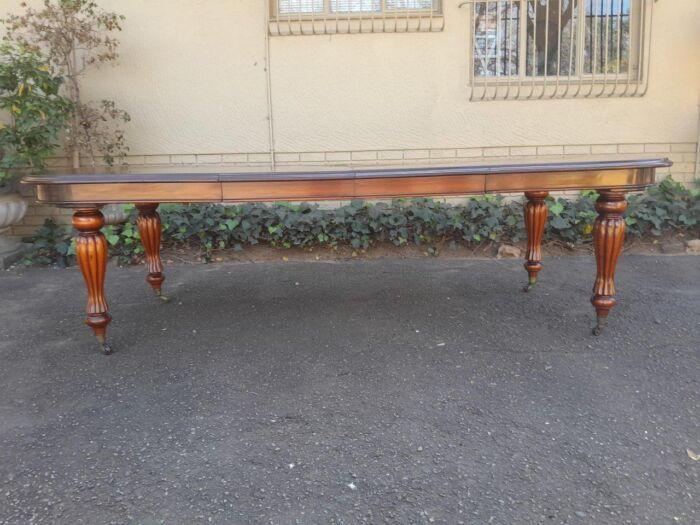 An Antique Victorian / Circa 1890s Dining Table With Two Leaves On Castors With A Crank Handle - Image 4