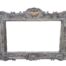 A 20th Century Victorian Style Heavily Carved Gilt And Green Mirror
