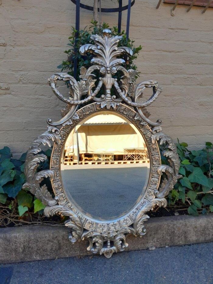 A French Style Ornately Carved And Bevelled Mirror In A Contemporary Silver Hand-Gilded Finish - Image 2