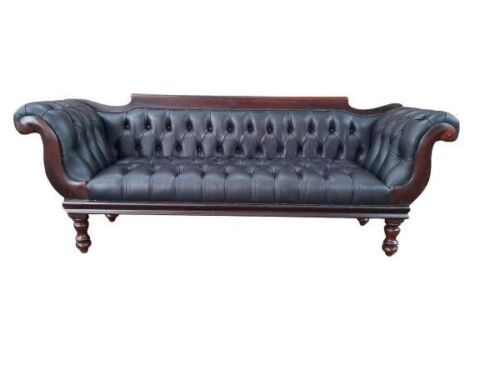 A 19th Century Regency Style Stinkwood Settee Upholstered In Deep Buttoned Leather