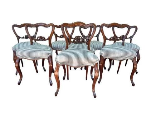An Antique Early 19th Century Set Of Eight Carved Rosewood Chairs Upholstered In A Ticking Cotton