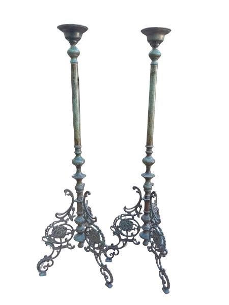 A 20th Century French Style Of Brass Floor Candle Holders With Patina