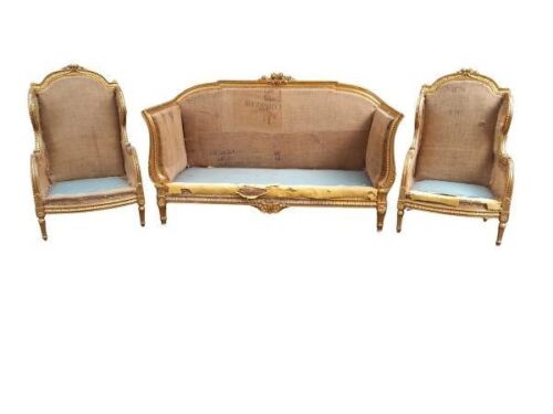 A 20th Century French Gilded And Ornately Carved Set Comprising Settee And Pair Of Wingback Arm-Chairs  Chair (Still To Be Upholstered)