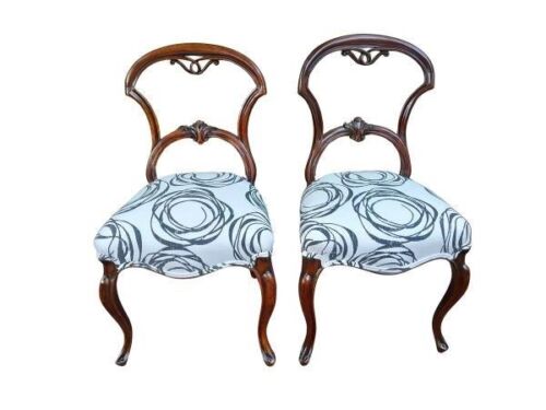 A 19th Century Victorian Pair Of Carved Balloon Back Chairs