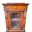 A Marquetry Pier Cabinet With Ormolu Mounts And A Glazed Door