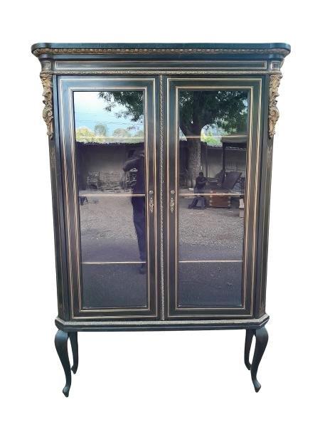 An Antique 19th Century Ebonised Cabinet With Inlay And Gilt Metal Glazed Doors