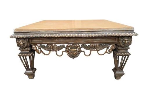 An Ornate Wrought Iron Coffee Table With Marble