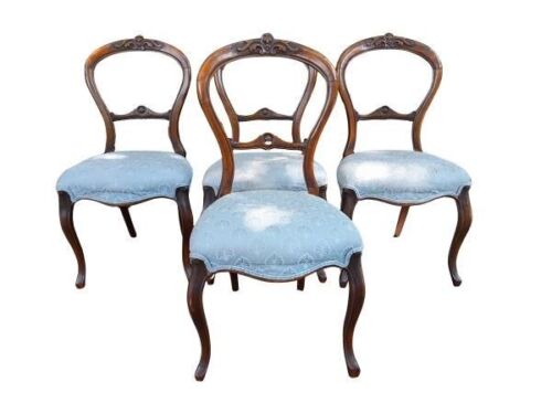 An Antique/Mid-Victorian Set Of Four Walnut Carved Balloon Back Chairs Upholstered In An Ivory Linen