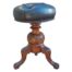 An Antique Victorian Carved Walnut Adjustable and  Revolving Piano Stool Upholstered in Leather
