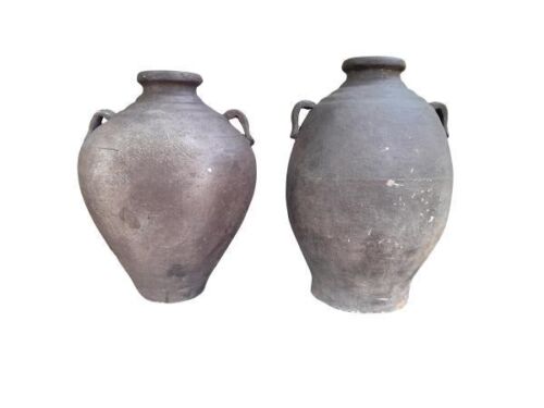 A Pair Of Decorative Urns With Patina