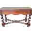A 20th Century French Walnut Table With Stretcher Base